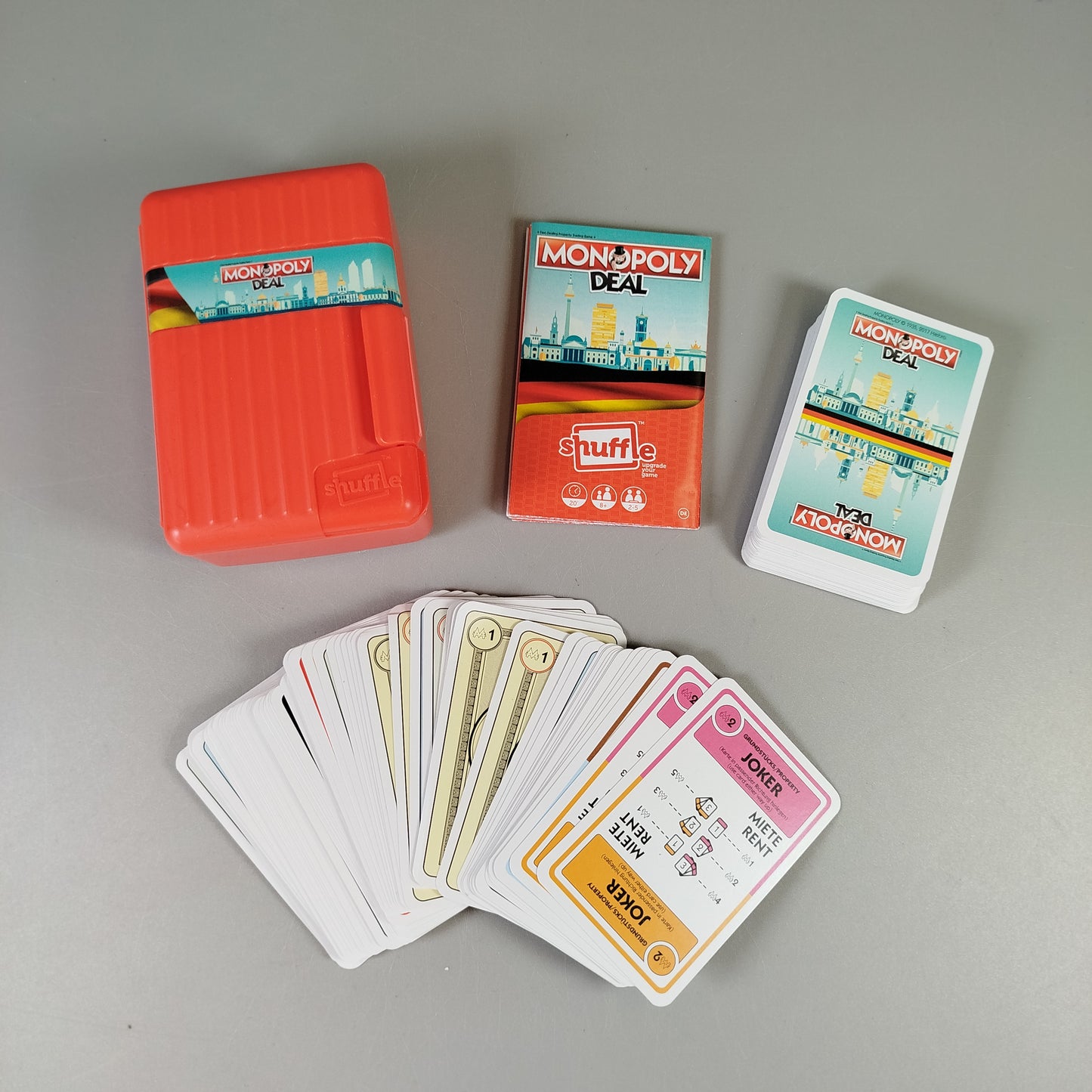 Brettspiel-Set – Flow, Monopoly Deal Shuffle Deutschland, Panic Lab